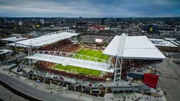Toronto — BMO Field: aerial view of an open stadium with white tent-like roof structures over the stands.