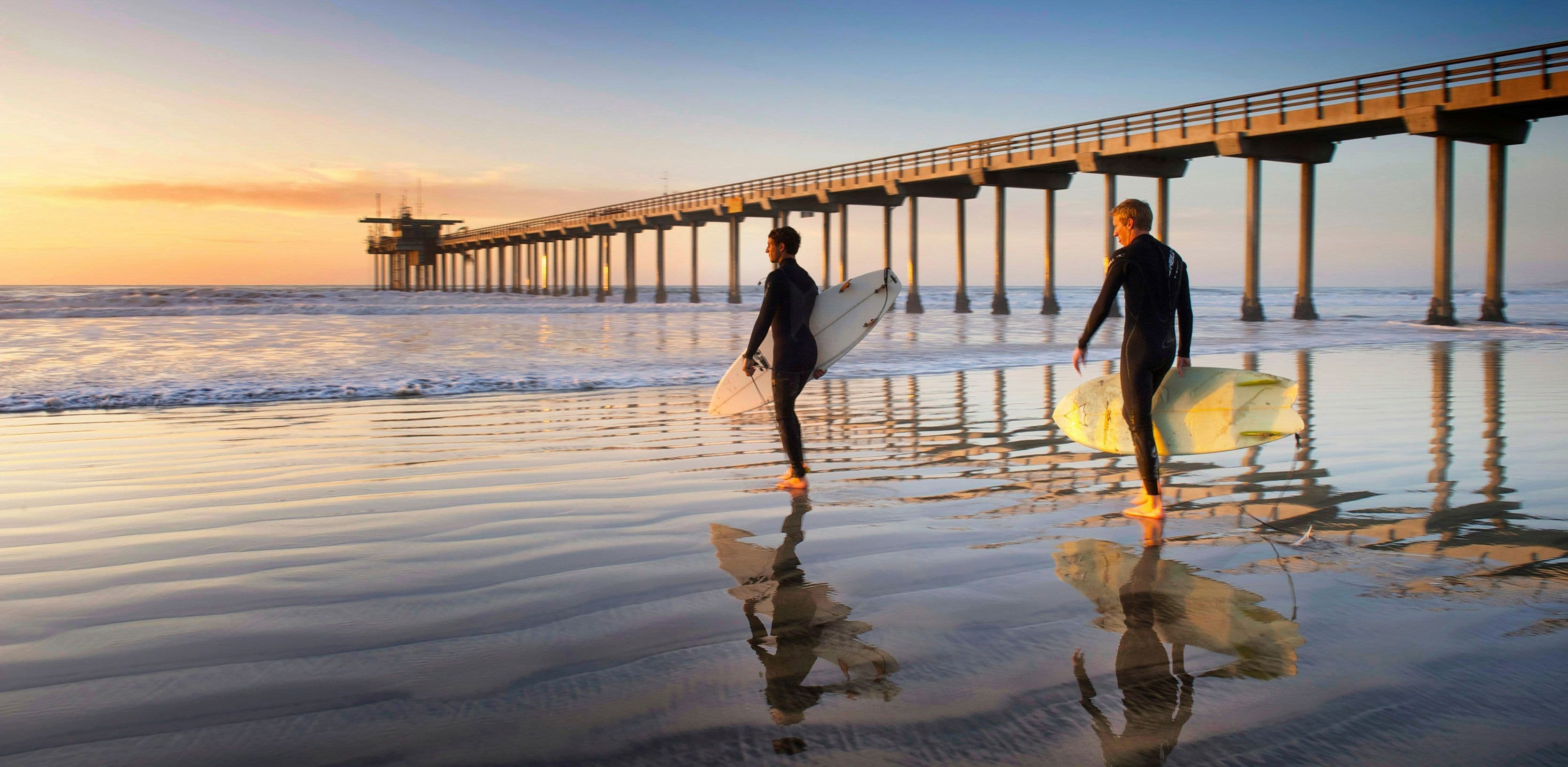San Diego surfers by the pier