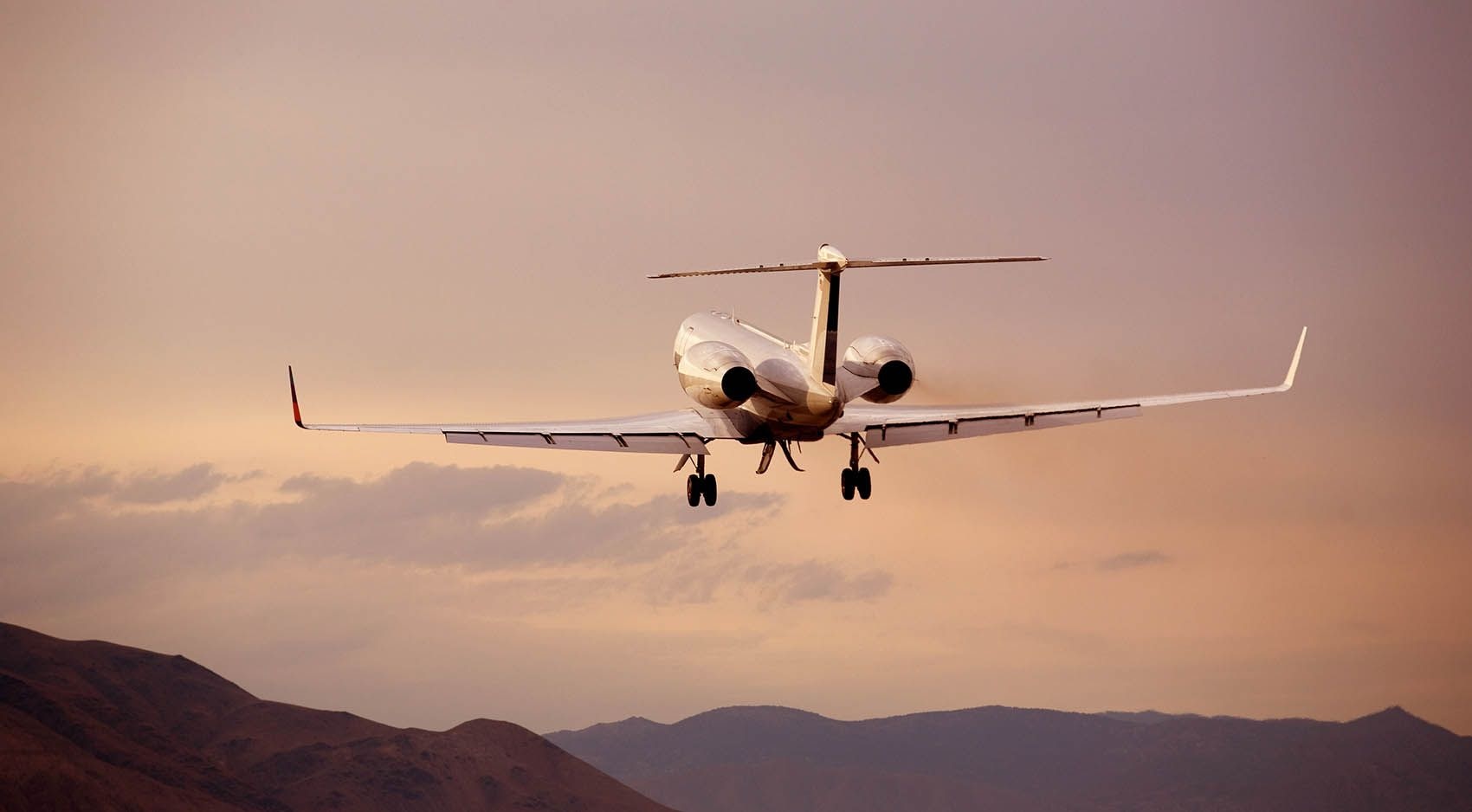 Private jet at sunset