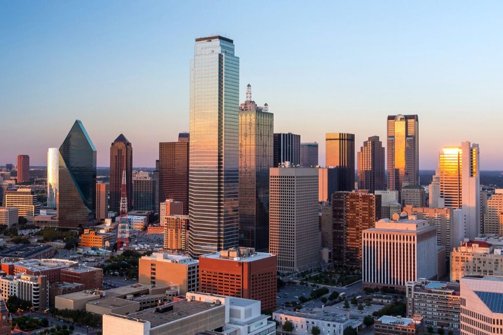  The iconic skyline of Dallas, Texas, at sunset, offering a picturesque backdrop for travelers arriving by private jet charter.