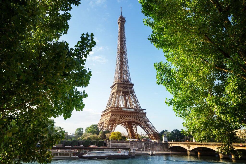 The romantic cityscape of Paris, France, with the Eiffel Tower in background at sunset.