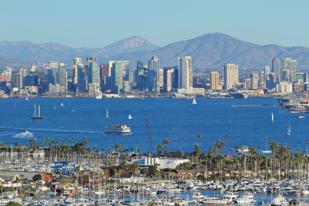 The picturesque marina and skyline of San Diego, highlighting the benefits of chartering a private jet to San Diego.